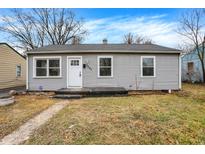 Charming single-story home featuring vinyl siding, a well-manicured lawn, and a welcoming front entrance at 3507 N Butler Ave, Indianapolis, IN 46218