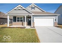 Charming single Gathering home with a two car garage and manicured lawn at 2160 Gambel Ln, Danville, IN 46122