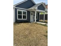 Charming craftsman style bungalow with gray siding, white trim, and a covered porch at 1260 S Reisner Sw St, Indianapolis, IN 46221
