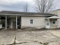 Front view of home with vinyl siding, stone accents and porch area at 850 N Anderson St, Elwood, IN 46036