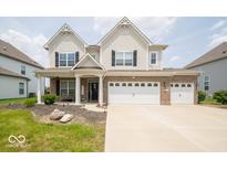Beautiful two-story home with a brick-accented facade and attached two car garage at 1220 Greenwood Station Blvd, Greenwood, IN 46143