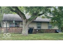 Charming single-story home with neutral siding, brick foundation, and well-manicured lawn, offering cozy curb appeal at 1902 Edgemont Way, Anderson, IN 46011