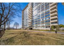 A condominium building featuring multiple stories, balconies, and a well-manicured lawn at 4000 N Meridian St # 14A, Indianapolis, IN 46208
