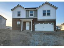 Two-story brick home with white accents and a two-car garage at 2028 Foothill Dr, Greenfield, IN 46140