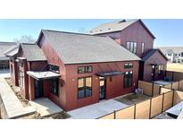 Modern home showcasing a unique exterior with dark trim and an inviting outdoor space at 1676 Solebar Way, Westfield, IN 46074