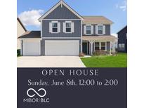 Charming two-story home featuring a two-car garage, a welcoming porch, and a well-manicured lawn at 1130 Cobra Dr, Franklin, IN 46131