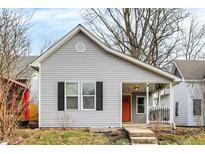 Gray house with orange door, black shutters, and a small porch at 1337 Linden St, Indianapolis, IN 46203
