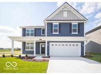 Beautiful two-story home with a blue exterior, white trim, and a two-car garage at 1537 Hanover St, Danville, IN 46122