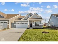 Charming two-story home with a well-maintained lawn, stone accents, and an attached two-car garage at 3551 Wrangler Dr, Bargersville, IN 46106
