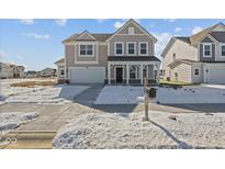 Charming two-story home with a covered porch and attached two-car garage at 10133 Redwood Peak Ln, Indianapolis, IN 46259