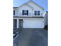 Charming two-story home with a two-car garage and well-maintained lawn, perfect for a growing Gathering at 10833 Penwell Way, Indianapolis, IN 46235