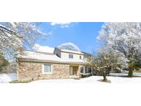 Brick ranch home with snow-covered landscaping and a spacious front yard at 3522 Beechwood Ln, Anderson, IN 46011