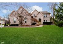 Brick two-story house with a large front lawn and driveway at 4729 Pearcrest Way, Greenwood, IN 46143