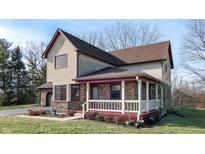 Two-story house with attached garage and covered porch at 9623 Mollie Ct, Indianapolis, IN 46259