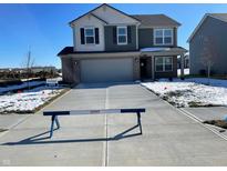 Two-story house with gray siding, brick accents, and a two-car garage at 6123 Card Blvd, Indianapolis, IN 46221