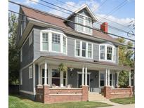 Charming two-story home with a welcoming front porch and classic architectural details at 414 E 17Th St, Indianapolis, IN 46202