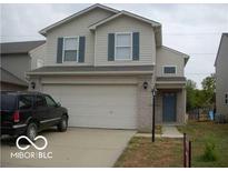 Charming two-story home featuring a two-car garage and a well-maintained lawn at 5325 Bluff View Dr, Indianapolis, IN 46217