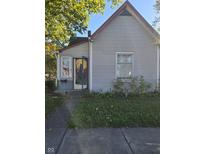 Grey siding house with front door and small yard at 2251 English Ave, Indianapolis, IN 46201