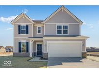 Charming two-story home showcasing curb appeal with vertical siding and a two car garage at 475 Chester Ln, Pittsboro, IN 46167