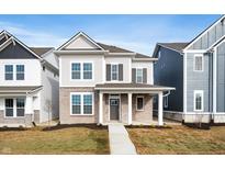 Charming two-story home featuring a brick facade, covered entry, and classic architectural details at 12013 Gia Ct, Noblesville, IN 46060