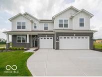 Beautiful two-story home with a three-car garage and a well-manicured front lawn at 236 Sam Himsel Way, Danville, IN 46122