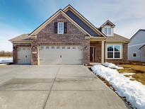 Brick house with 3-car garage, and a large front yard at 5009 Carmine St, Brownsburg, IN 46112