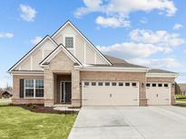 Brick house with 3-car garage, stone accents and landscaping at 4998 Carmine St, Brownsburg, IN 46112