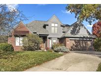 Charming two-story home with a combination of brick and gray wood, plus a well-maintained front yard at 12132 Kingfisher Cir, Indianapolis, IN 46236