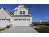 Two-story townhome with attached two-car garage and landscaping at 16990 Silo Ridge Way, Noblesville, IN 46060