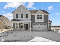 Charming two-story home featuring a covered porch, white trim and a two car garage at 4193 Bozeman Way, Bargersville, IN 46106