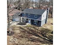 Two story home features a well-maintained yard and a classic, welcoming facade at 839 Fernwood Ct, Indianapolis, IN 46234