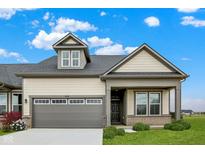 Charming single-Gathering home with a gray garage door, manicured lawn, and appealing curb appeal at 18322 Depoe Ln, Westfield, IN 46074