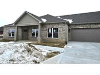 Brick ranch home with attached garage and covered porch at 2327 Saddle Dr, Shelbyville, IN 46176