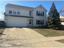 Traditional two-story home with a two-car garage and concrete driveway at 1418 Osprey Way, Greenwood, IN 46143