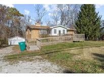 Charming brick home featuring a convenient handicap ramp and a detached garage at 6436 E Hadley Rd, Mooresville, IN 46158