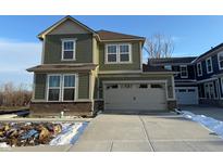 Charming two-story home with an attached two-car garage and a classic craftsman design at 15905 Tharp Woods Dr, Fishers, IN 46037