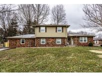 Charming brick home featuring well-kept lawn and two-story design at 5230 N County Rd 50 E, Shelbyville, IN 46176
