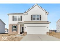 Two story home featuring a front-facing two car garage, partial brick facade, and a symmetrical facade at 908 Stonehaven Dr, Indianapolis, IN 46239