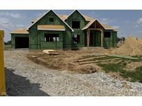 Under construction, the home's exterior is framed with green sheathing and features a covered porch entryway at 8030 Totton Ct, Zionsville, IN 46077