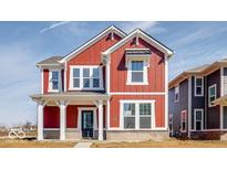 Charming two-story home showcasing red siding, white trim, and covered porch enhancing curb appeal at 9344 Anthem Ave, Plainfield, IN 46168