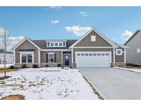 Craftsman style home with gray siding, white trim, and a two-car garage at 7098 Sterling Way, Brownsburg, IN 46112