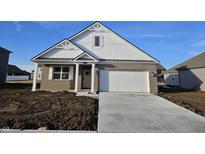 Charming single-Gathering home featuring a two-car garage, brick accents, and a well-manicured lawn at 6296 Granby Dr, Whitestown, IN 46075