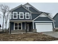 Two story home with gray siding, white accents, and a large garage at 19955 Boulder Brook Ln, Westfield, IN 46074