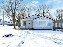 Cozy ranch home with snow-covered yard at 401 Elva St, Anderson, IN 46013