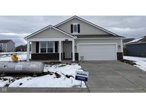 New construction home with gray siding and a two-car garage at 5226 Woodhurst Ln, Indianapolis, IN 46239