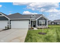 Craftsman style home with gray siding, white trim, and a 2-car garage at 155 Maxim Ct # 093-B, Cumberland, IN 46229