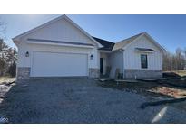 Charming new construction featuring white siding and a brick accent, offering a modern look at 5143 Oak Ridge Pl, Columbus, IN 47201