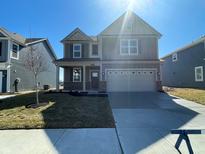 Charming two-story home with a two-car garage, covered porch and traditional architectural design at 1567 Hanover St, Danville, IN 46122