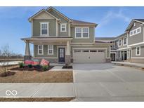 Charming two-story home featuring a two-car garage and inviting front porch at 16043 Meadow Frost Ct, Fishers, IN 46037