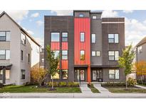 Contemporary three-story home with contrasting brick and red metal siding at 1825 N New Jersey St, Indianapolis, IN 46202